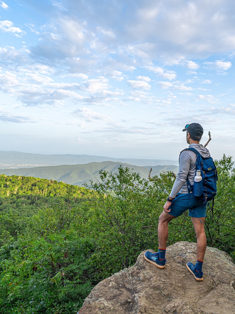 Man standing at a viewpoint along the Bearfence Mountain Trail in Virginia.