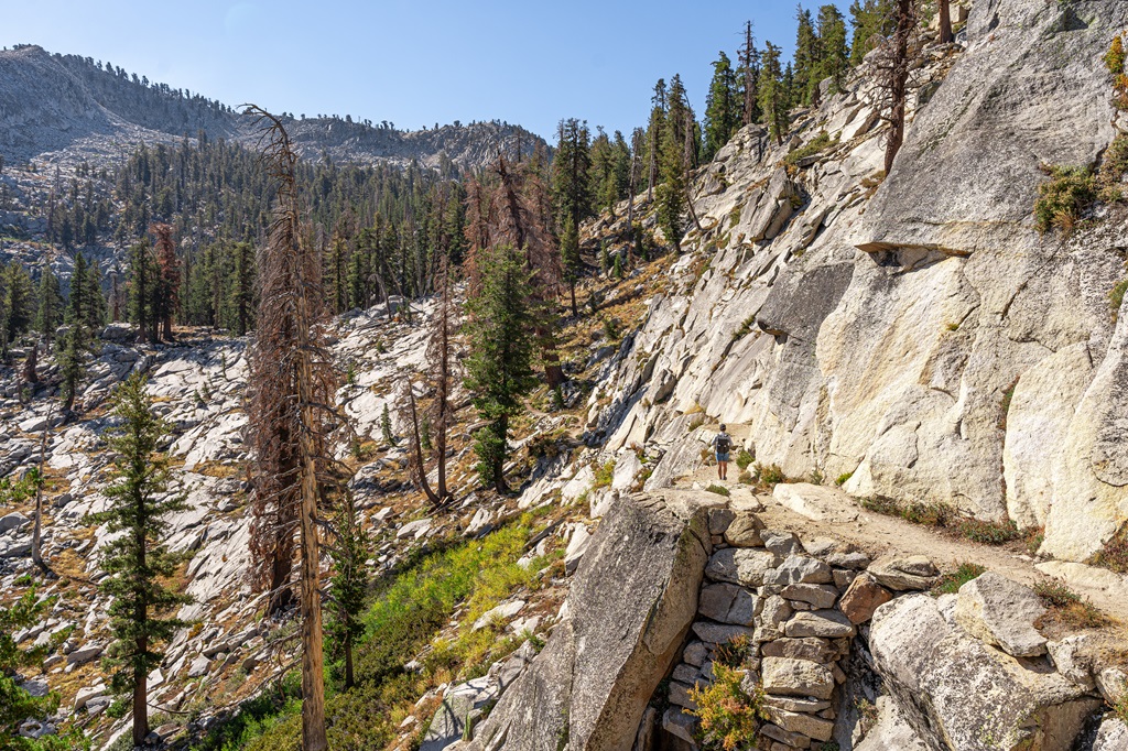 Man hiking along the Watchtower Trail.