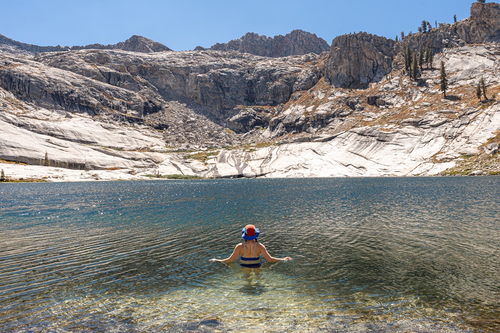 Woman cold plunging in Pear Lake in Sequoia National Park.