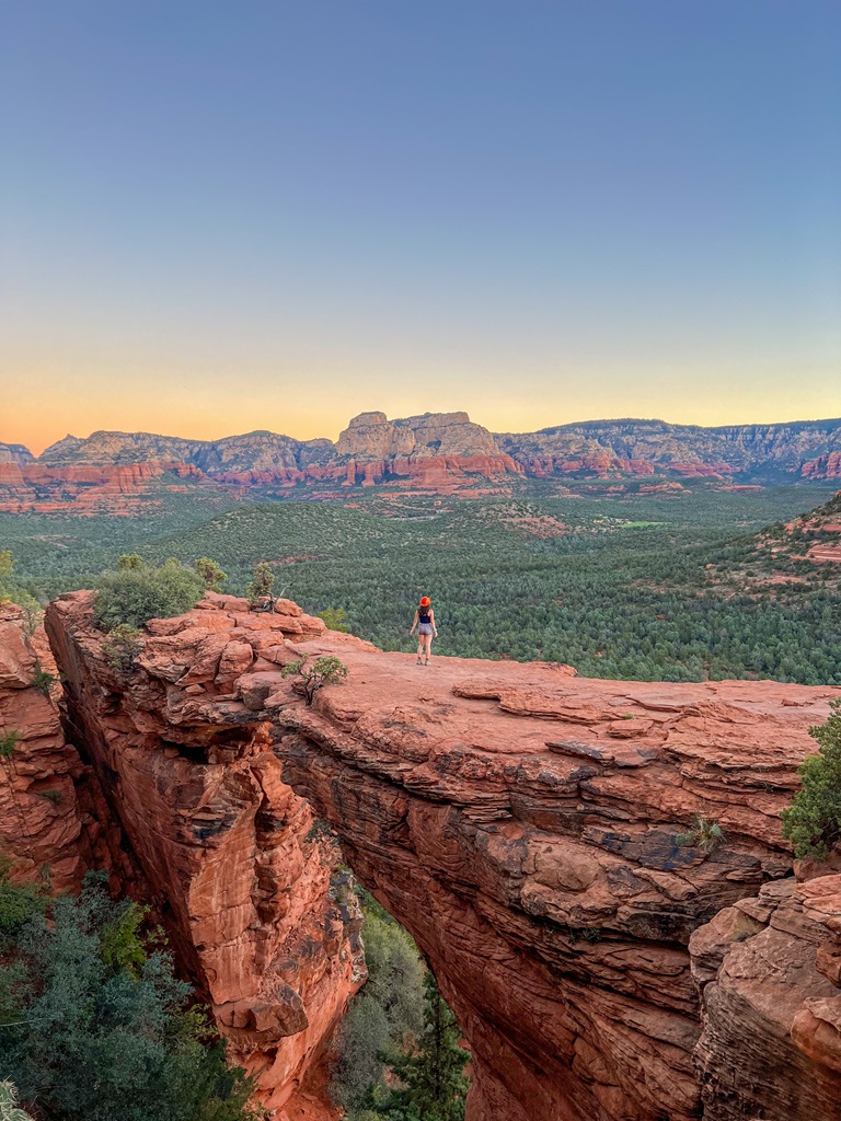 Woman standing on Devil's Bridge in Sedona, Arizona.