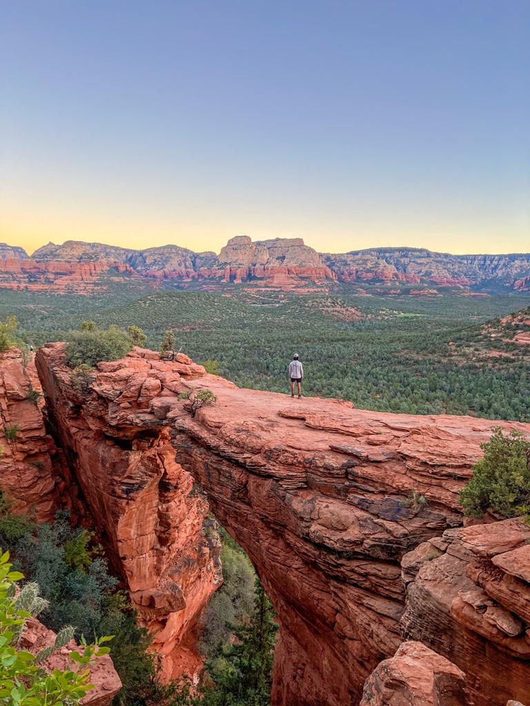 Man standing on Devil's Bridge in Sedona, Arizona.