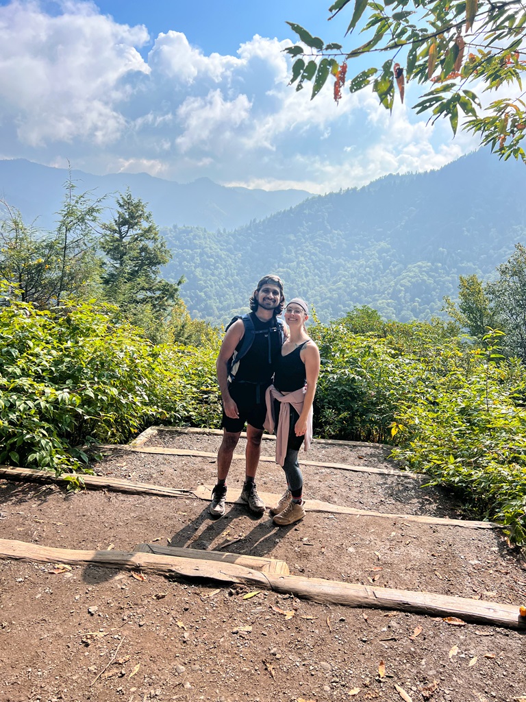 Man and woman standing together at the Chimney Tops Overlook in the Great Smoky Mountains National Park.