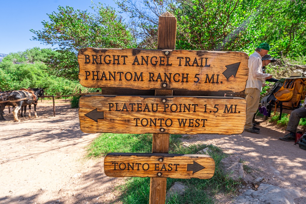 Trail sign at Havasupai Gardens showing the direction for Bright Angel Trail, Phantom Ranch, and Plateau Point.