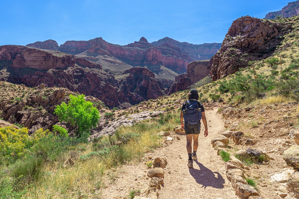 Man hiking along the Bright Angel Trail.