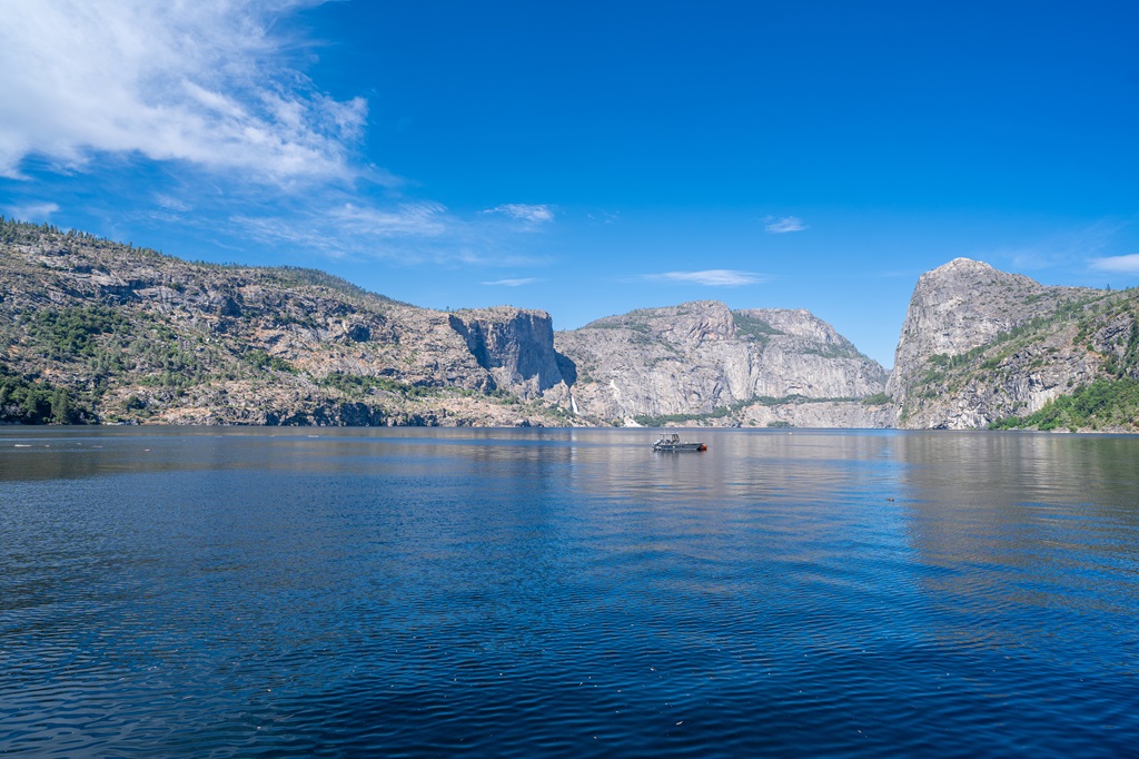 Views from the O'Shaughnessy Dam of Hetch Hetchy Reservoir with Wapama Falls and Kolana Rock in the distance.