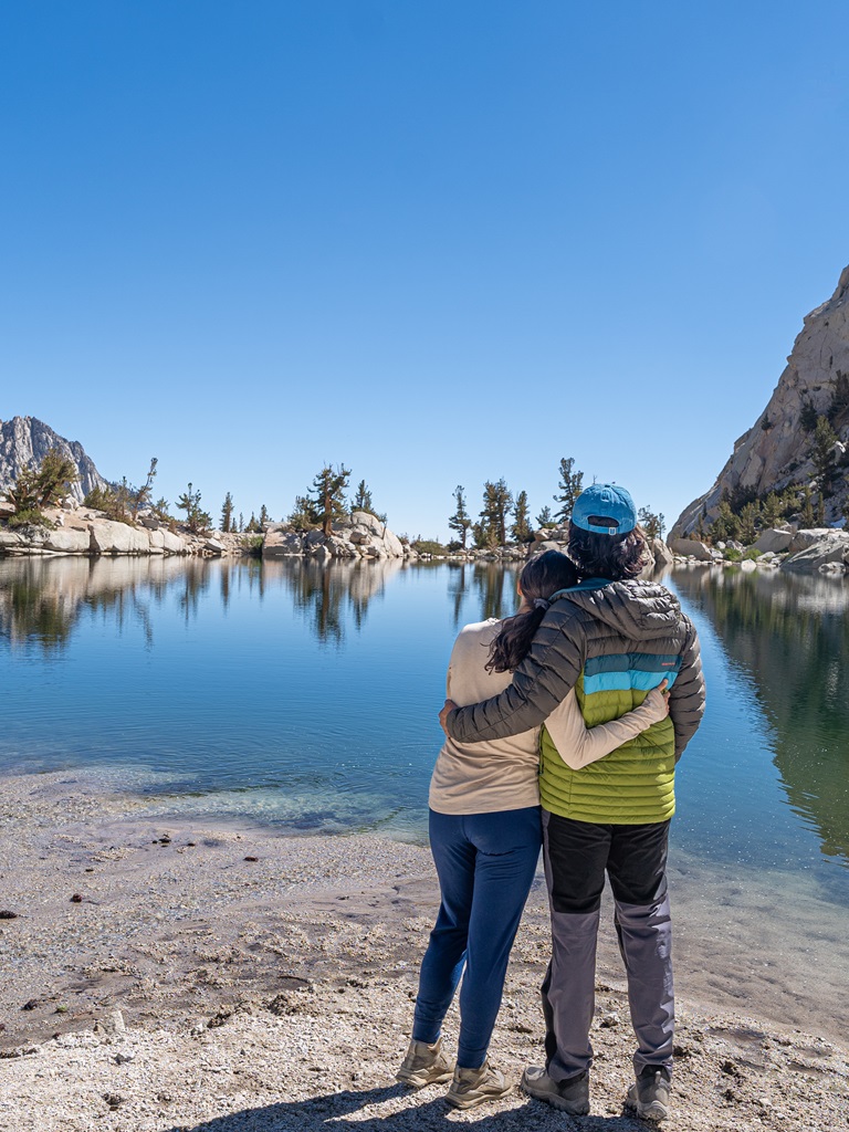 Man and woman enjoying the views of Lone Pine Lake in California.