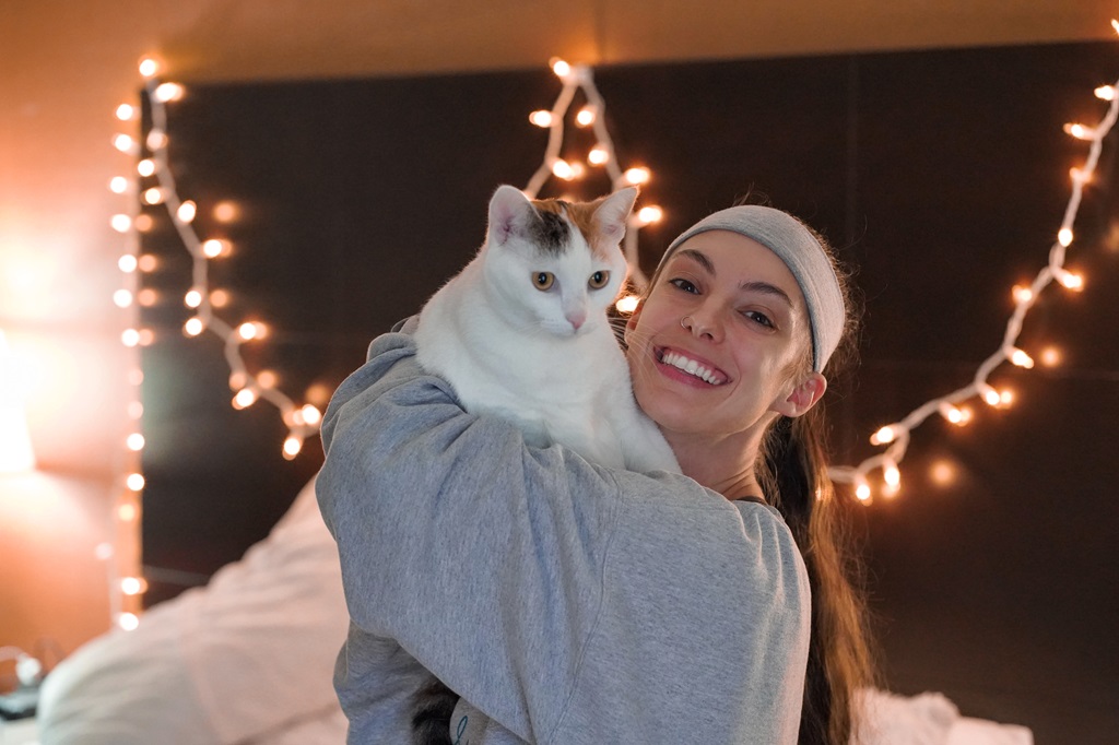 Woman holding a cat.