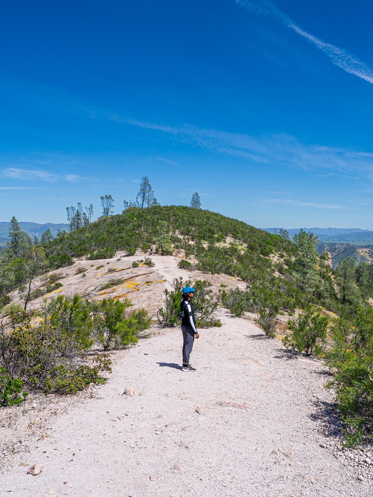 Man standing on the High Peaks Trail in Pinnacles National Park.