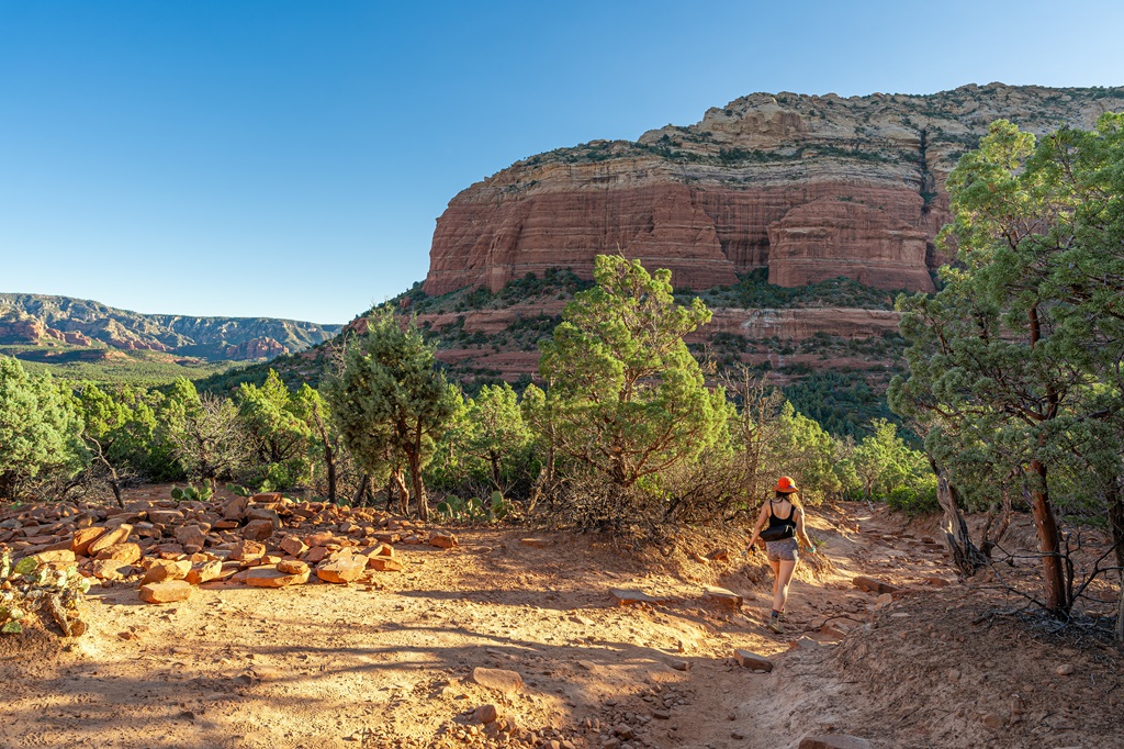 Woman hiking along the trail towards Devil's Bridge in Sedona, Arizona.