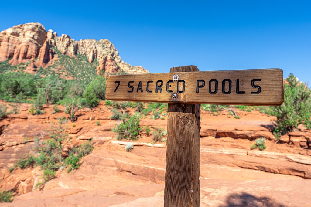 Trail sign indicating the 7 Sacred Pools along the Soldier Pass Trail.