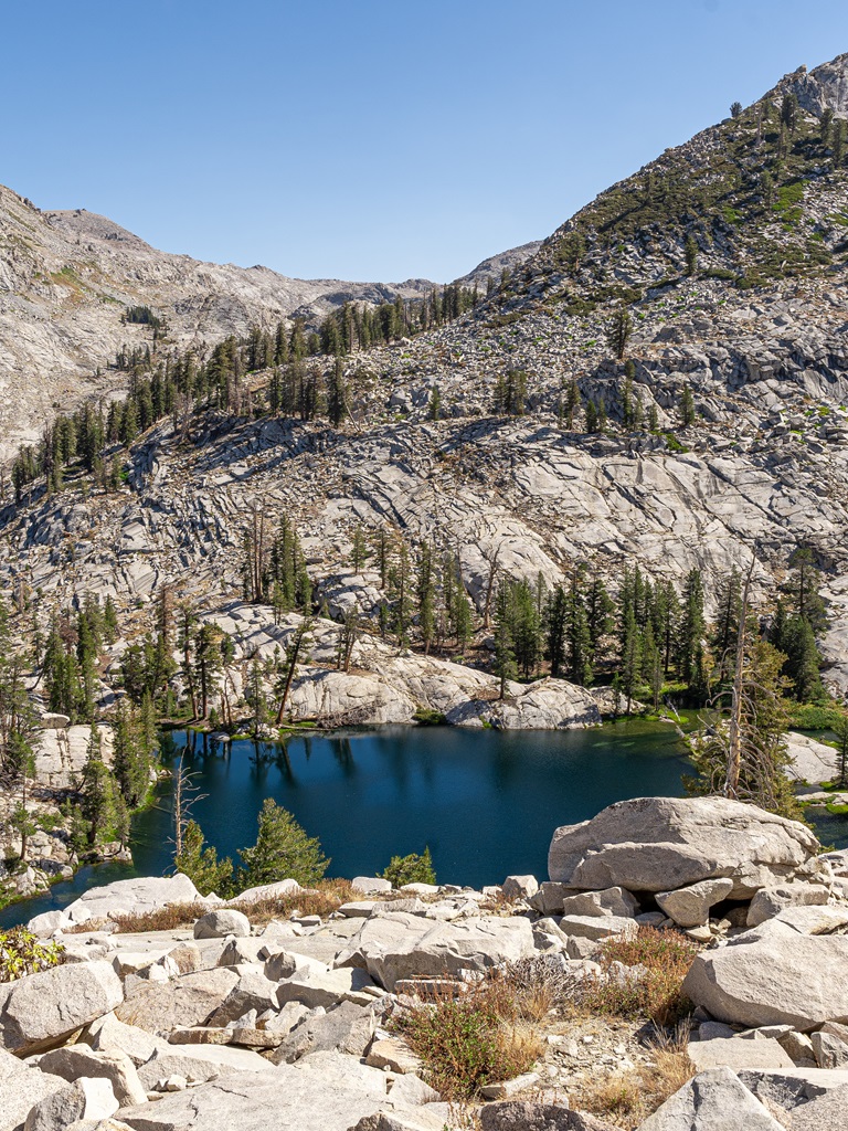 Dark blue colored lake known as Aster Lake in Sequoia National Park.