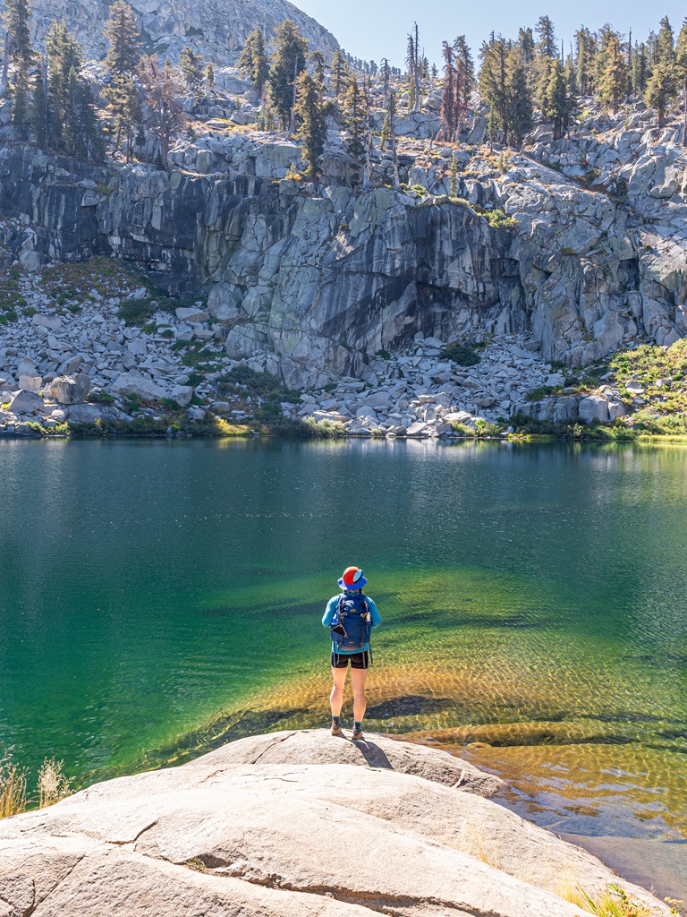 Woman standing in front of Heather Lake in Sequoia National Park.