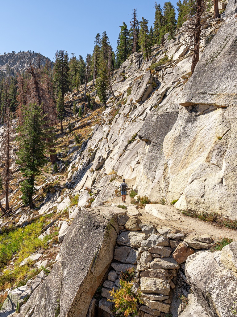 Man hiking along the Watchtower Trail.