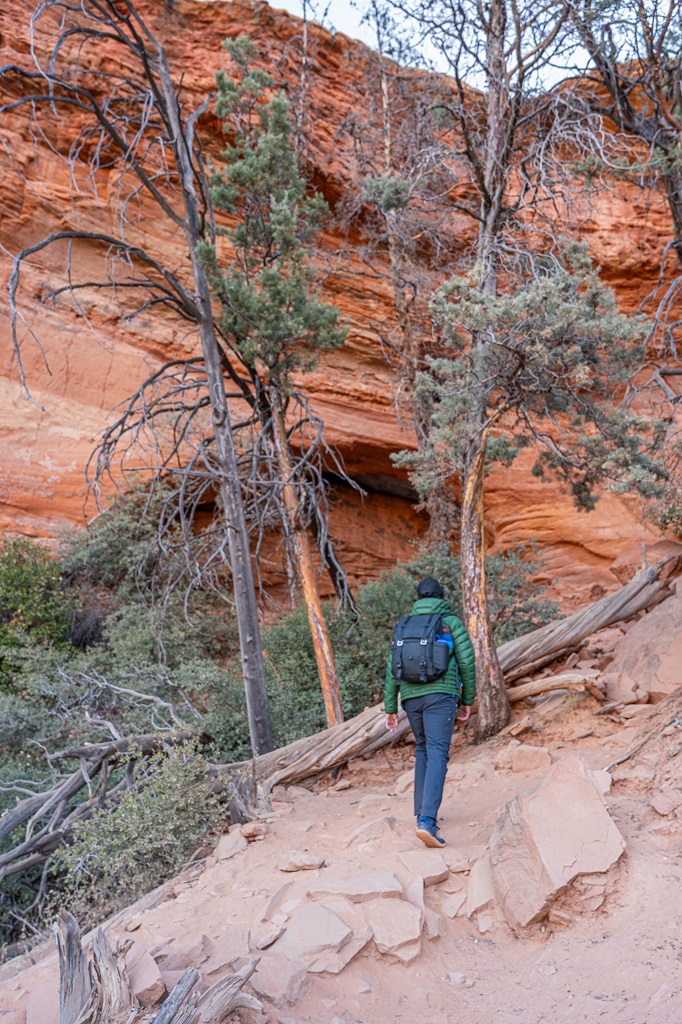 Man hiking towards the Soldier Pass Cave in Sedona.