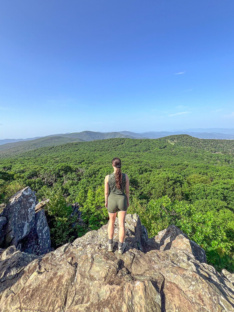 Woman standing on Stony Man Summit looking at the views in Virginia.