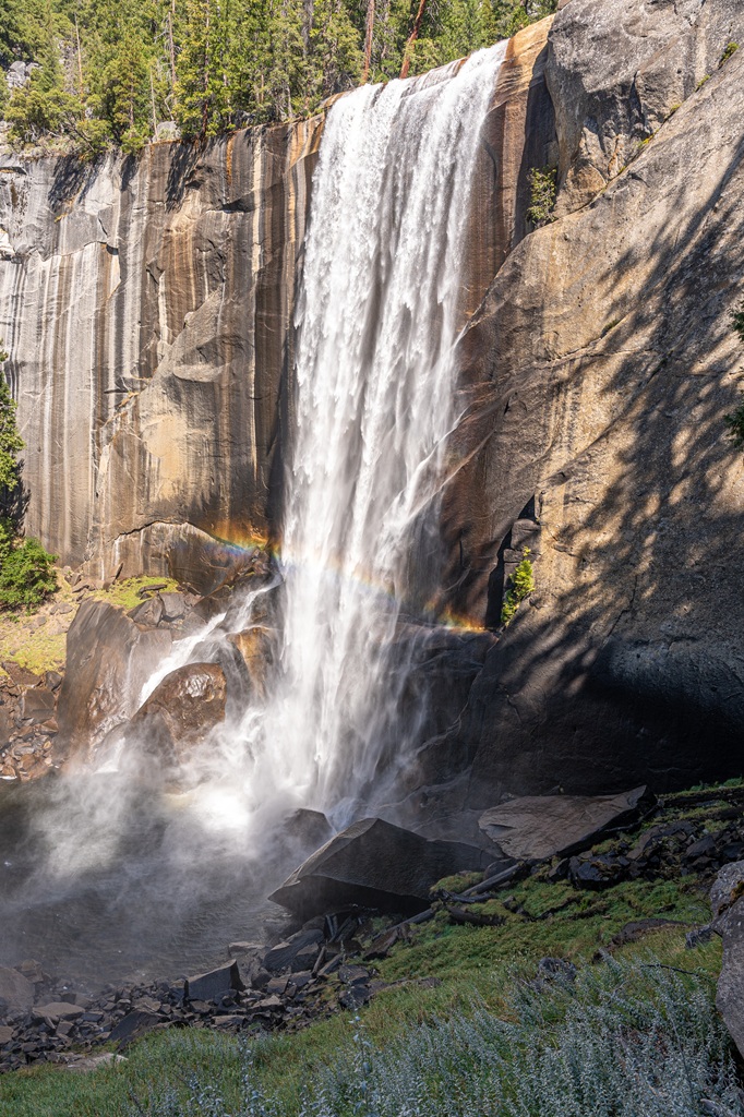 Rainbow at base of Vernal Fall seen from the Mist Trail in Yosemite National Park.