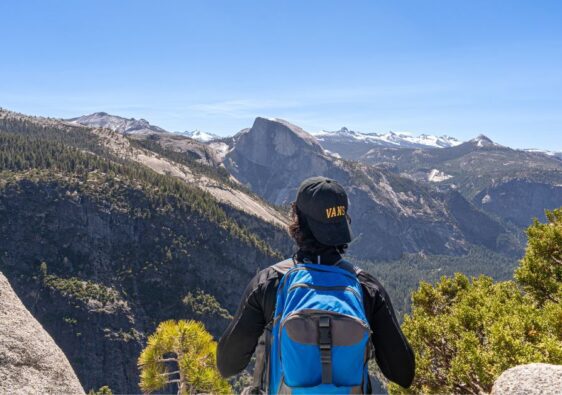 Man looking at the views from Yosemite Point.