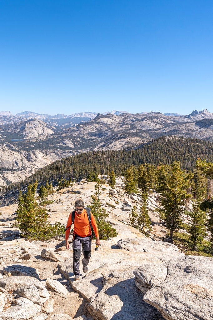 Man hiking up the ridge of Clouds Rest.