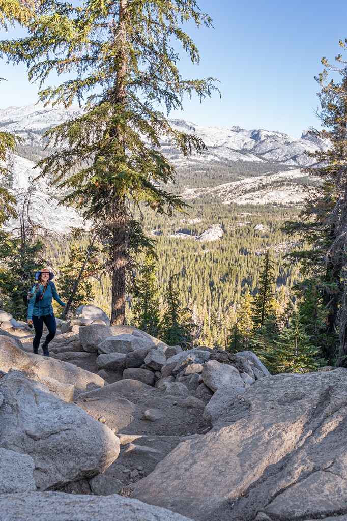 Woman tackling switchbacks on the Clouds Rest hike in Yosemite.