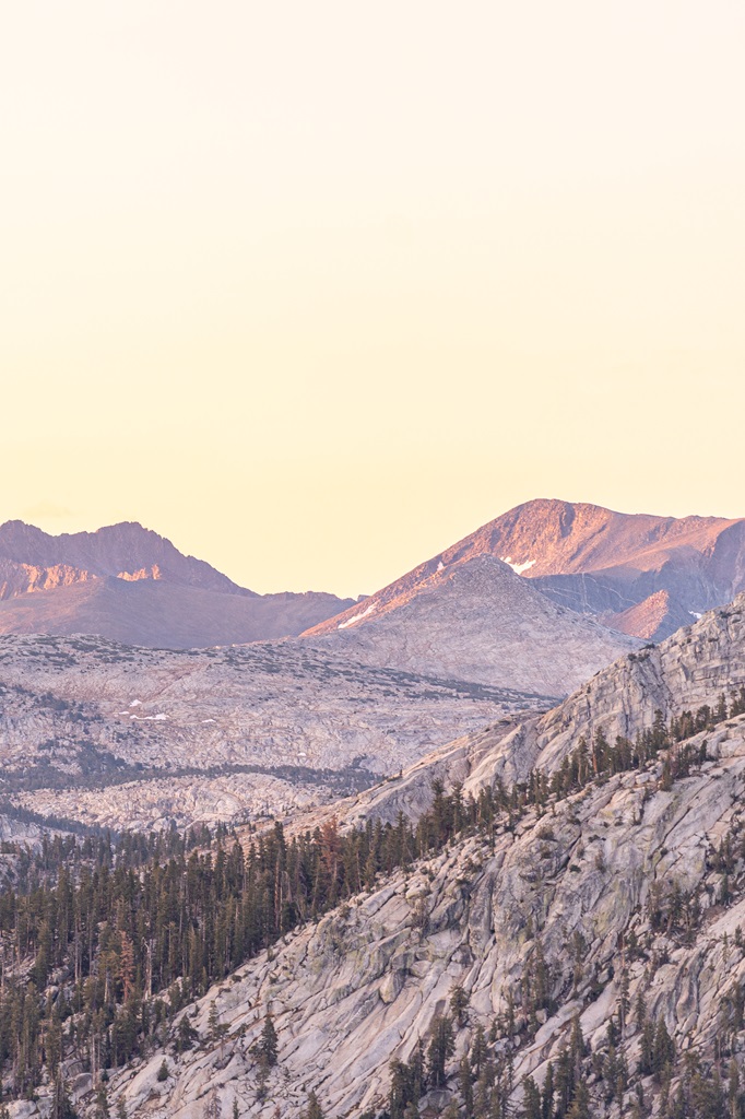 View of mountain peaks from Lembert Dome during sunrise.