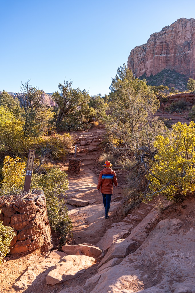 Woman hiking along the Bell Rock Climb trail in Sedona.