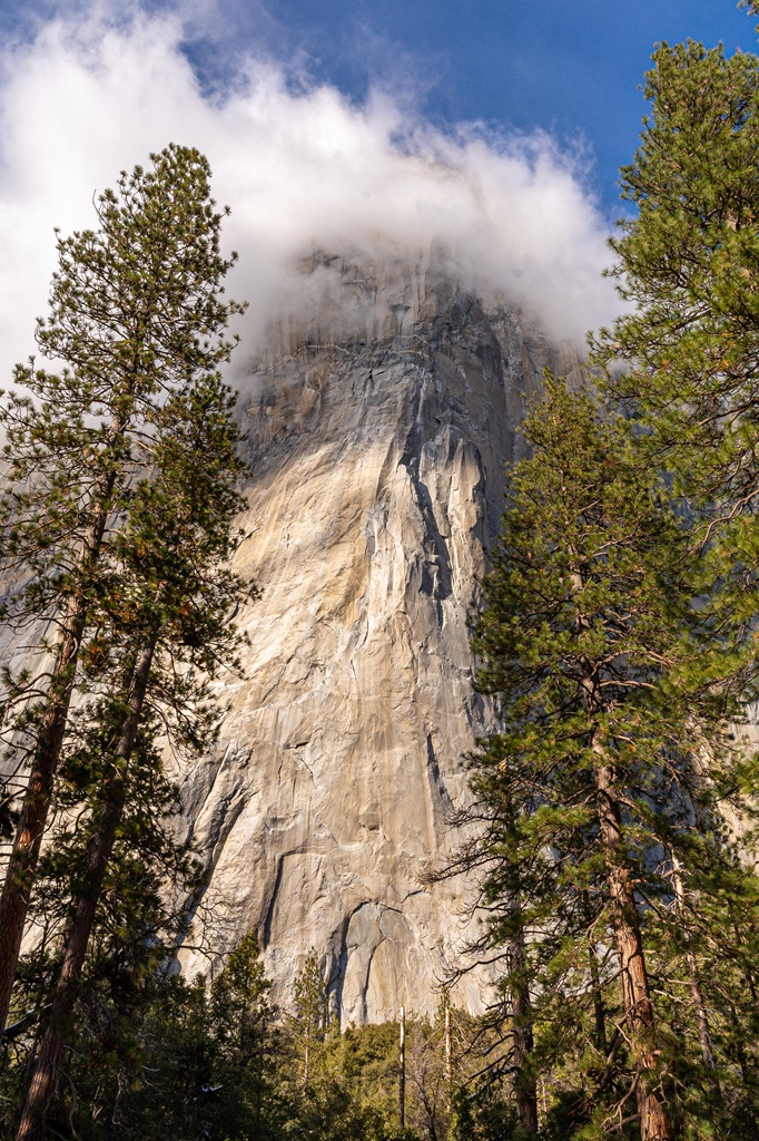 Close-up view of El Capitan in Yosemite with a cloud covering the top.