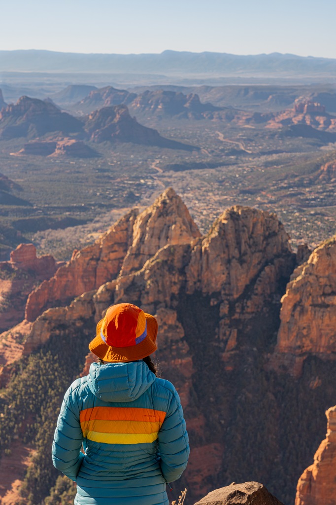 Woman looking at the views from the Sedona Overlook on Wilson Mountain in Sedona.