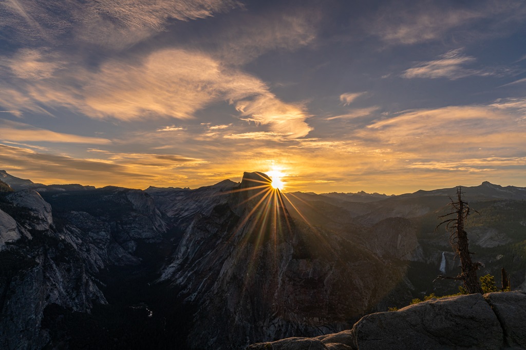 Sun rising behind Half Dome at Glacier Point in Yosemite National Park.