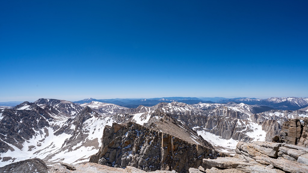 Stunning views of snowy mountains from the summit of Mt Whitney.