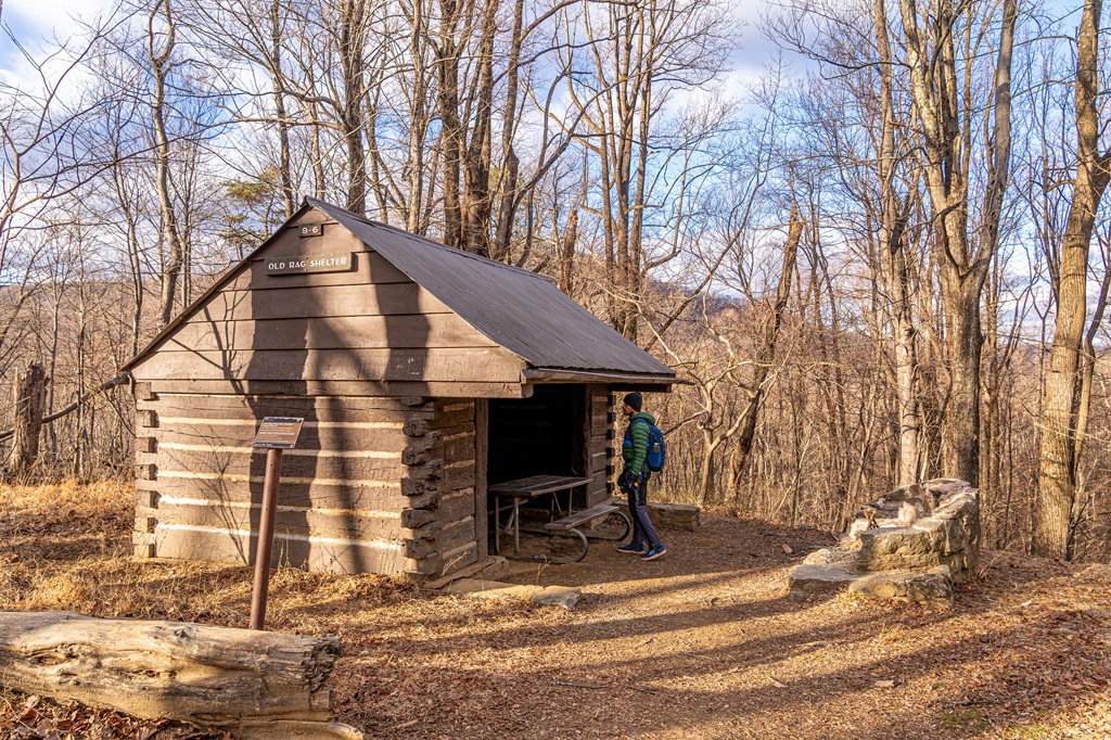 Man looking inside the Old Rag Shelter off the Saddle Trail in Virginia.