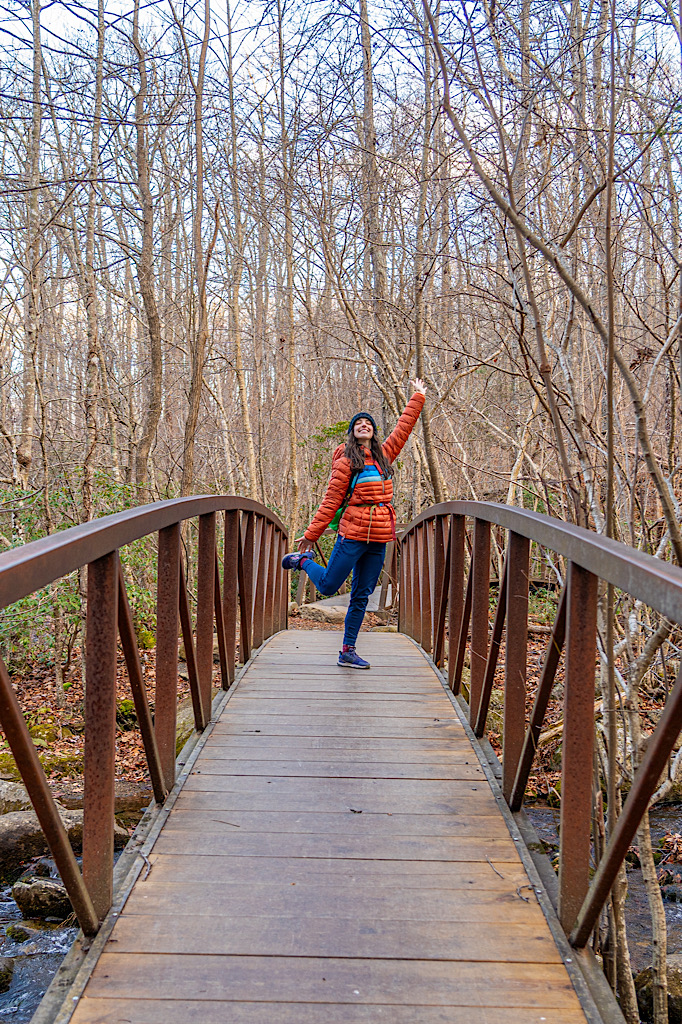 Woman posing on a footbridge along the Weakley Hollow Fire Road near Old Rag.