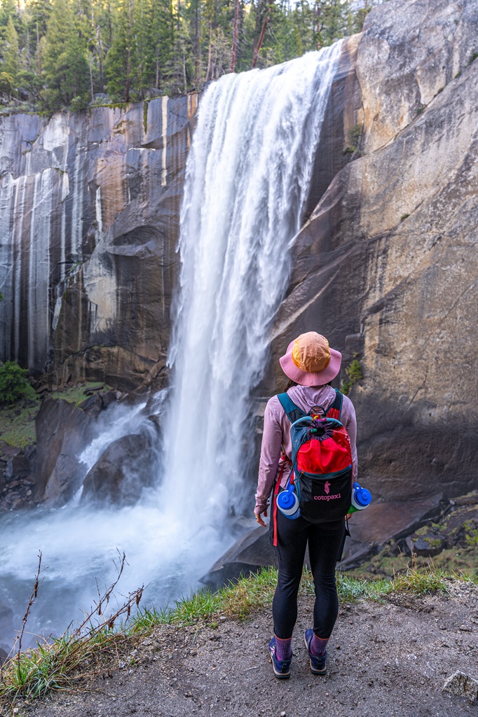 Woman looking at Vernal Fall from the Mist Trail in Yosemite National Park.