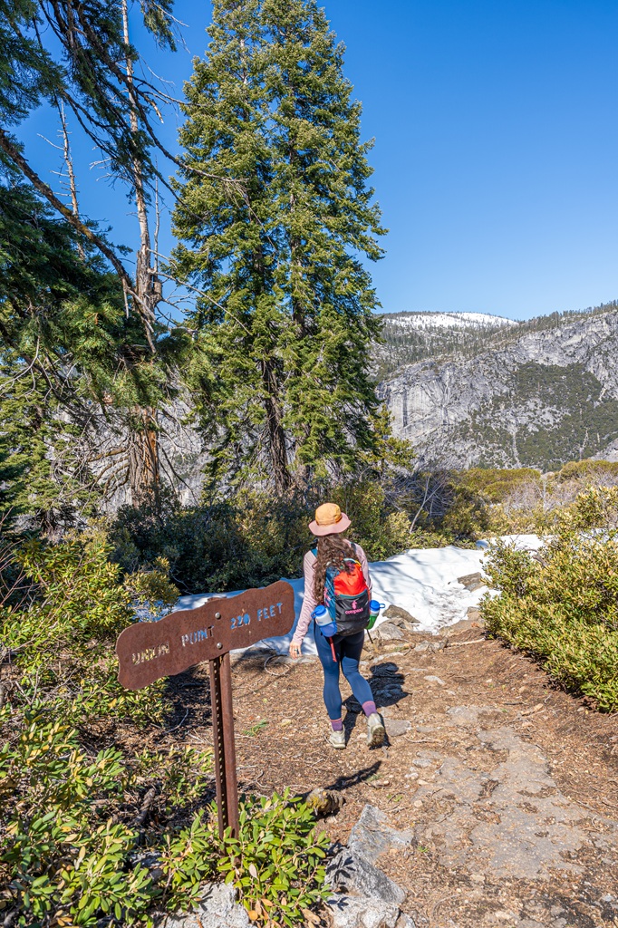 Woman hiking to Union Point off Four Mile Trail in Yosemite National Park.