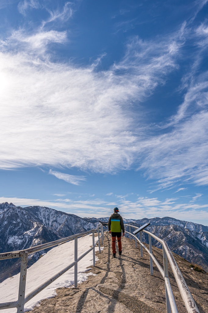 Man walking along the summit of Moro Rock in Sequoia National Park.