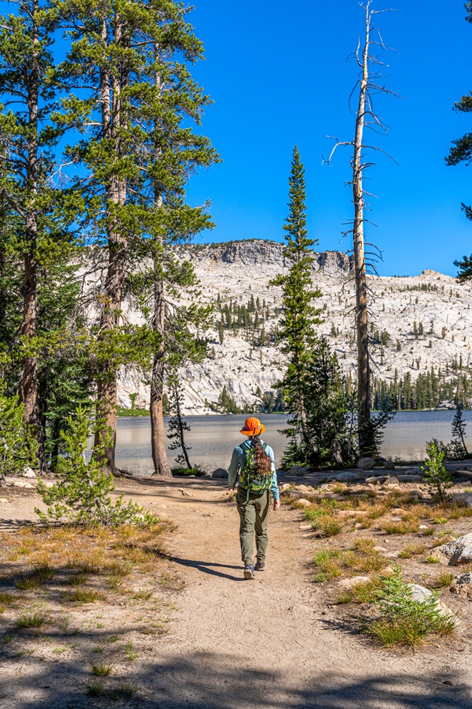 Woman hiking towards May Lake in Yosemite National Park.
