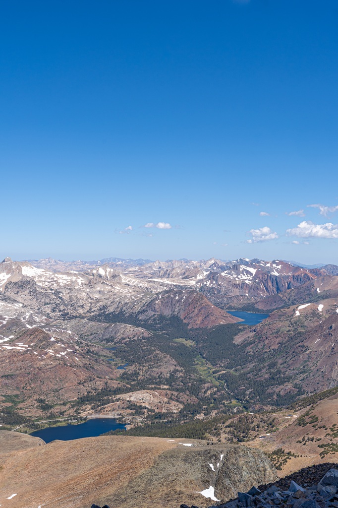 Views of snowy peaks and alpine lakes from Mount Dana's summit in Yosemite National Park.