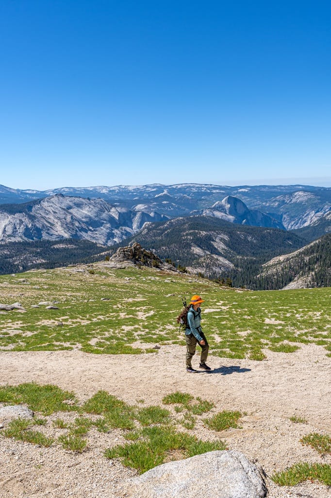 Woman hiking towards the summit of Mount Hoffmann in Yosemite National Park.