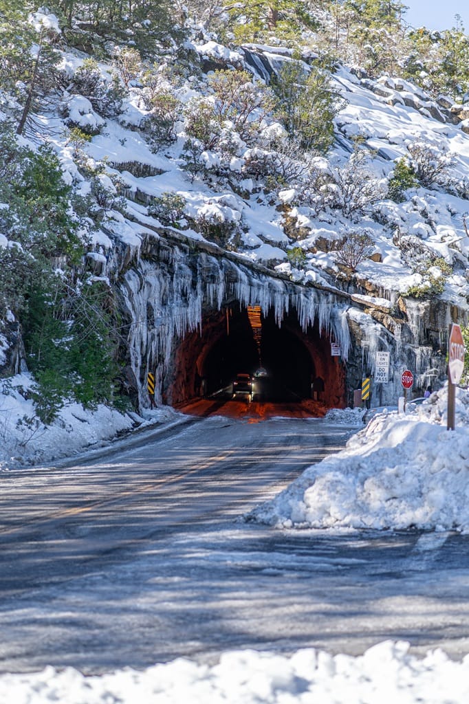 Wawona Tunnel in winter with icicles hanging from the top in Yosemite National Park.