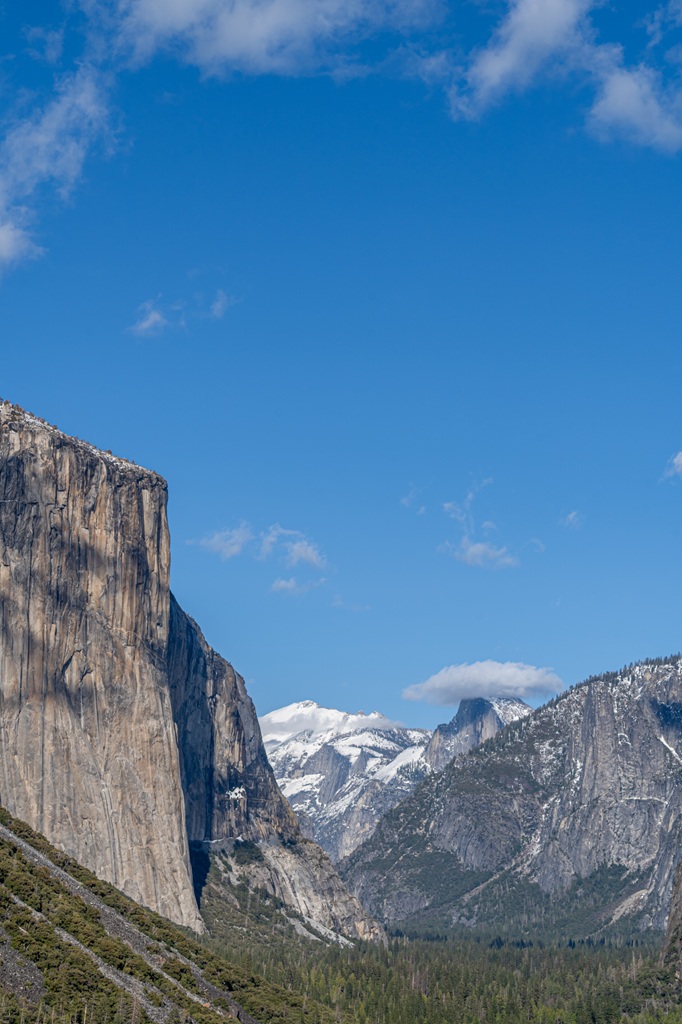 View of Half Dome, El Capitan, and snow-covered Clouds Rest from Tunnel View in Yosemite National Park.