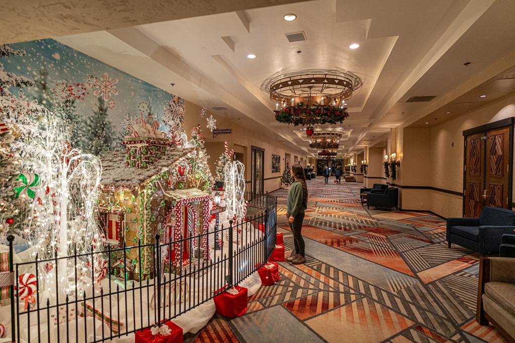 Woman looking at holiday decorations at Tenaya Lodge.