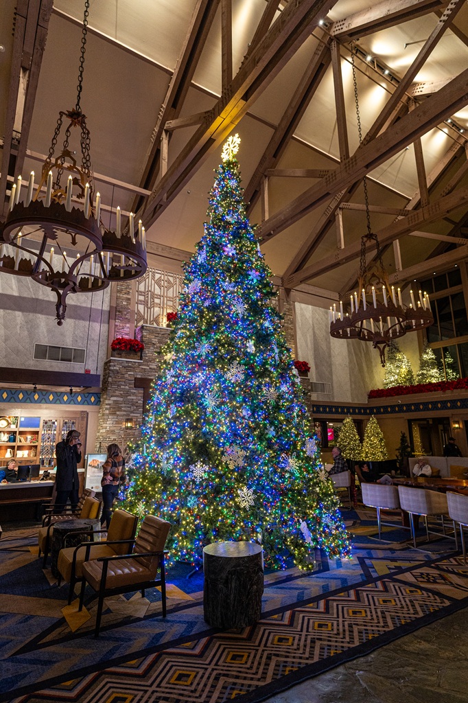 Beautifully lit Christmas tree at Tenaya Lodge in winter.