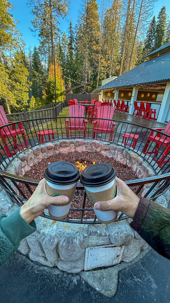 Two coffee cups with fire pit in the background at Tenaya Lodge.