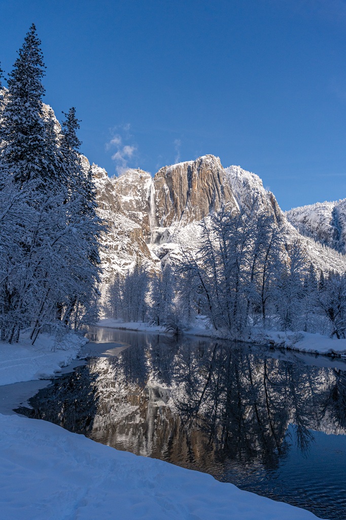 View of Yosemite Falls from Swinging Bridge Picnic Area in Yosemite Valley in mid-winter.