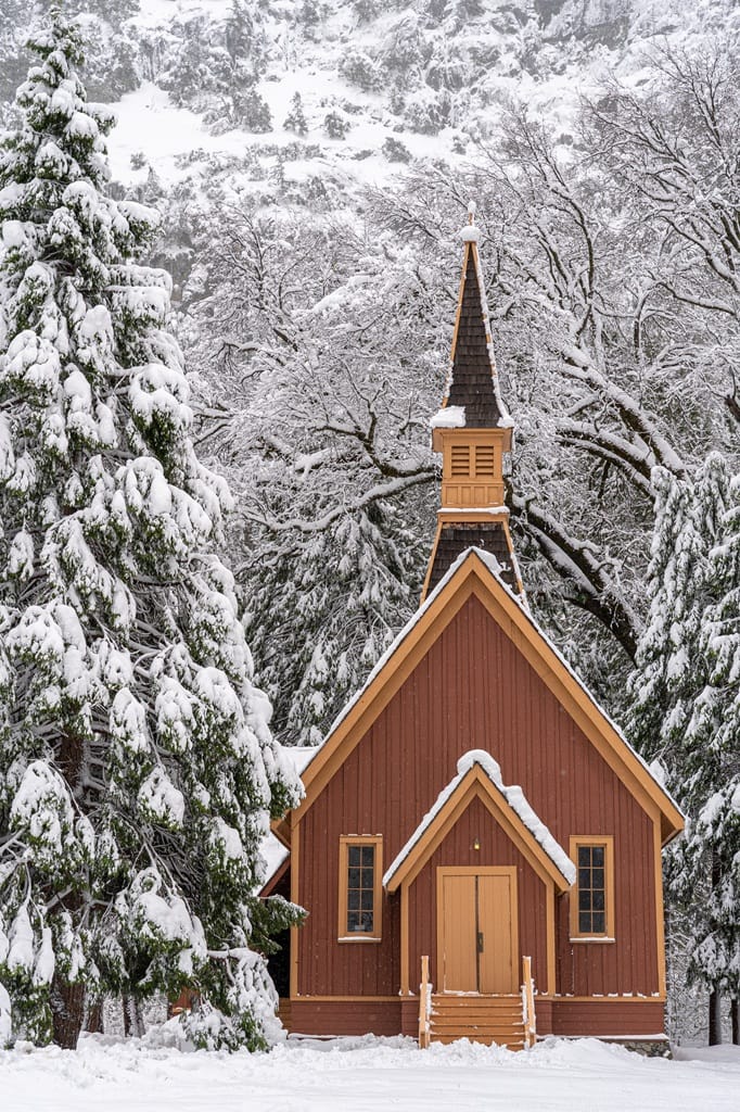 Yosemite Valley Chapel covered in snow in Yosemite National Park.
