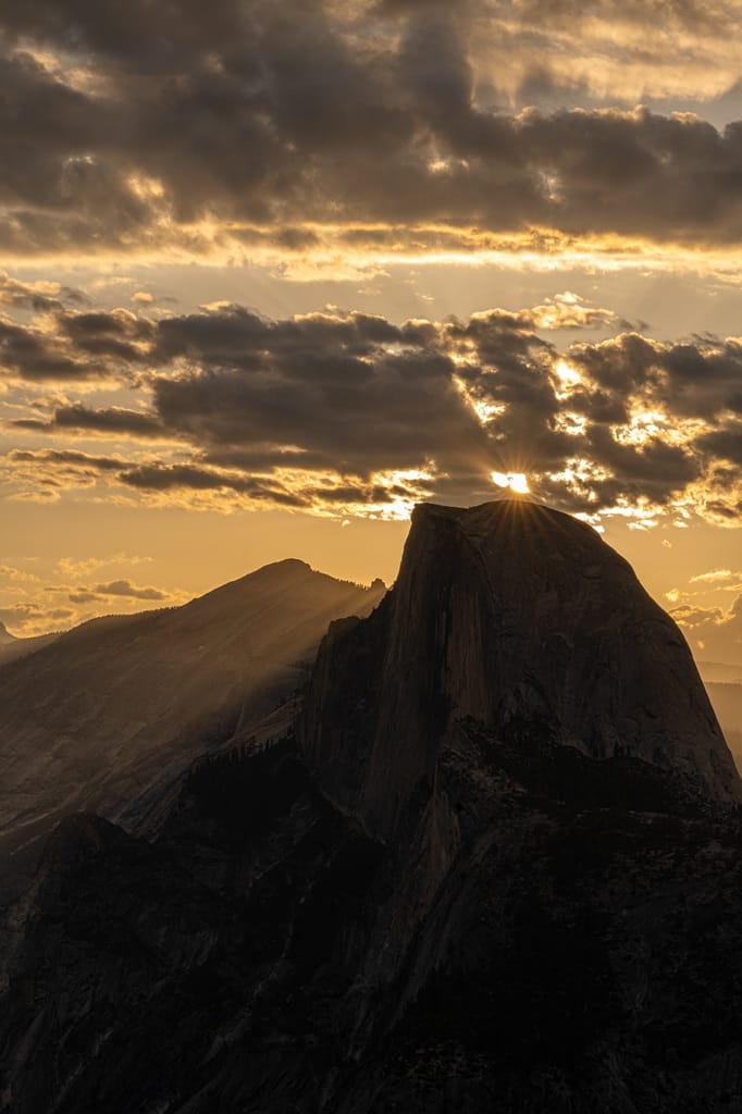 View of Half Dome and Clouds Rest during sunrise at Glacier Point in Yosemite National Park.