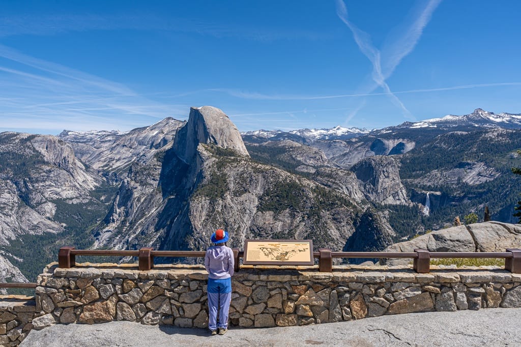 Incredible views of Half Dome, Nevada Fall, and distance peaks seen from Glacier Point in Yosemite National Park.